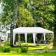 White 10 x 20 feet canopy tent with six sidewalls, ideal for outdoor events like parties and weddings.