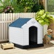 Durable plastic dog house with a blue roof, providing shelter and comfort for pets in outdoor settings.