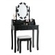 Black makeup dressing table with lighted mirror, cushioned stool, and four storage drawers for cosmetics organization.