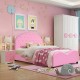 Twin size upholstered toddler bed in pink with soft foam padding, designed for safety and comfort in kids' rooms.