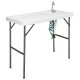 Folding cleaning sink table with sprayer, durable plastic surface, integrated sink, perfect for outdoor cleaning tasks.