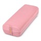Yoga bolster pillow in pink with a washable cover and carry handle, designed for comfort and support during yoga.