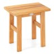 Teak shower bench with solid construction, water-resistant finish, and compact design for versatile indoor or outdoor.