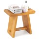 Teak shower bench with curved seat, solid construction, and water-resistant finish, ideal for shaving legs or as a side.