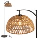 Arc floor lamp with a black metal base and woven hanging lampshade, ideal for living room or bedroom lighting.