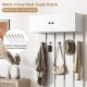Wall-mounted coat rack in white with upper storage and 5 metal hooks, ideal for maximizing entryway space.