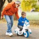 Child riding a 12V unicorn toy with training wheels, featuring a cute design and safe operation for outdoor fun.