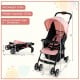 Toddler travel stroller in pink with adjustable backrest, foldable design, and safety harness for convenient use.