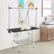 Foldable dog grooming table with adjustable arms, non-slip surface, and storage tray for pet care and grooming.