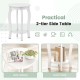 Round 2-tier side table in white with rubber wood legs and storage shelf, perfect for living room or bedroom use.