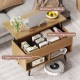 Lift-top coffee table with spacious tabletop, hidden storage, and two open shelves in natural finish for versatile use.