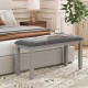 Upholstered gray bedroom bench with padded seat and solid wood legs, perfect for stylish seating and storage.