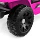 Close-up of the black tire on a pink 12V kids ride-on truck, featuring a rugged design for smooth driving adventures.