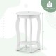 White 15-inch round end table with 2-tier design, rubber wood legs, and storage shelf for living room or bedroom use.