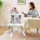 Baby high chair in grey with adjustable height, activity center, and 5-point harness for safe feeding and playtime.