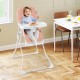 Compact pink highchair with adjustable tray and footrest, designed for easy cleaning and child safety in dining spaces.