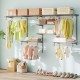 Wall-mounted closet organizer with 7 shelves and 5 hanging rods, ideal for laundry or bedroom storage in grey.