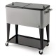 Portable gray patio cooler with bottom storage shelf, bottle opener, and wheels for easy mobility and access to.