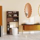 Over-the-toilet cabinet with adjustable shelves, modern design, and smart toilet bidet for efficient bathroom storage.