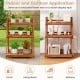Foldable 3-tier solid wood plant stand with slatted shelves, ideal for patio or balcony plant display and home decor.