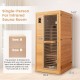 Single-person far infrared sauna made of Canadian hemlock with a tempered glass door, ideal for home relaxation.