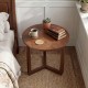 Round side table with sturdy rubber wood legs in walnut finish, perfect for rustic farmhouse interiors and versatile.