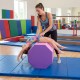 Octagon tumbling mat in pink, 22.5" x 26", supports gymnastic skills and balance training for kids in a gym setting.