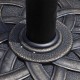 Close-up of the 22-inch heavy-duty round umbrella base stand with a decorative bronze finish and steel construction.