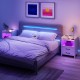 Nightstand with charging station, LED lighting, and open storage shelf in white, ideal for modern bedroom decor.