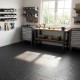 Black 1/2" puzzle exercise floor mats made of EVA foam, ideal for gyms and playrooms with a non-slip texture.