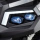 Close-up of the headlights on a black 24V kids golf cart, featuring blue accents and modern design for fun outdoor play.