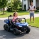 Kids ride-on dump truck with electric dump bed, 2-seater design, and remote control for outdoor adventures.