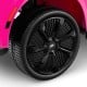 Close-up of the black wheel on a pink 24V licensed Cadillac ride-on truck for kids, featuring a stylish design.