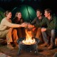 Portable 24.5-inch propane fire pit with folding legs and carry strap, perfect for outdoor gatherings and warmth.