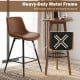 24-inch brown bar stool with curved back and footrest, featuring a heavy-duty metal frame for added stability.