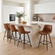 Set of two 24-inch brown bar stools with backs and footrests, featuring faux leather upholstery and sturdy metal legs.