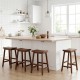 Backless 24-inch solid wood saddle bar stools in brown, perfect for kitchen island seating with ergonomic design.