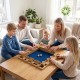 Family playing the 24-inch extra-large Shut The Box game on a coffee table, perfect for social gatherings and game.