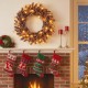 24-inch pre-lit Christmas wreath with 35 warm white LED lights and natural pine cones, perfect for festive wall decor.