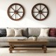 Set of 2 decorative wooden wagon wheels, 24" diameter, carbonized solid fir wood, perfect for rustic wall decor.