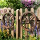 Decorative 24-inch wooden wagon wheels made of carbonized fir wood, perfect for rustic indoor and outdoor decor.