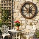 Decorative 24-inch wooden wagon wheel in a rustic setting, enhancing outdoor charm with a carbonized finish.