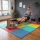 Colorful interlocking EVA foam floor tiles provide non-slip protection and comfort for home gym and living room use.