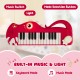 Dinosaur-shaped 25-key kids piano keyboard in red with built-in music, light, and easy-carry handle for fun learning.