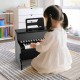 Kids piano keyboard in black with 25 keys, ideal for toddlers, featuring adjustable speed and teaching mode for.