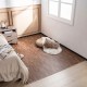 Brown wood grain foam floor mats with borders, arranged in a cozy bedroom setting for stylish flooring.