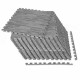 Gray wood grain foam floor mats stacked with borders, ideal for creating a comfortable flooring solution.