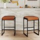 Set of 2 counter height bar stools with brown faux leather seats and sturdy metal frames, perfect for kitchen islands.