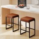 Set of 2 brown 26-inch bar stools with faux leather seats and sturdy metal frames, perfect for kitchen islands.