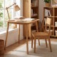 Square bamboo dining table for 2-4 people with natural finish, ideal for compact spaces and versatile use.